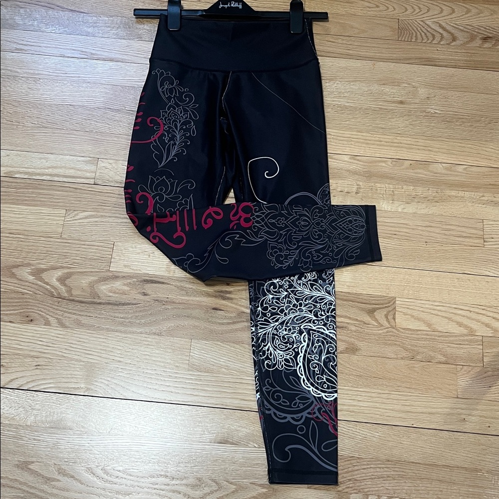 Elegant Black Leggings with Red and White Swirls